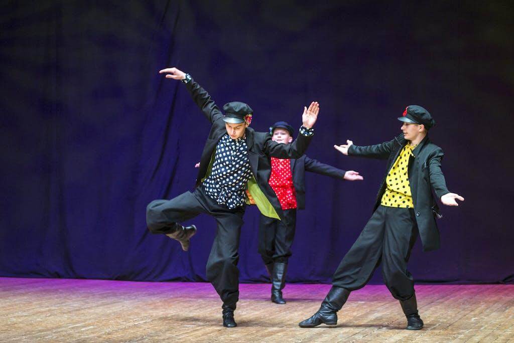 Photograph of Boys Dancing on a Stage